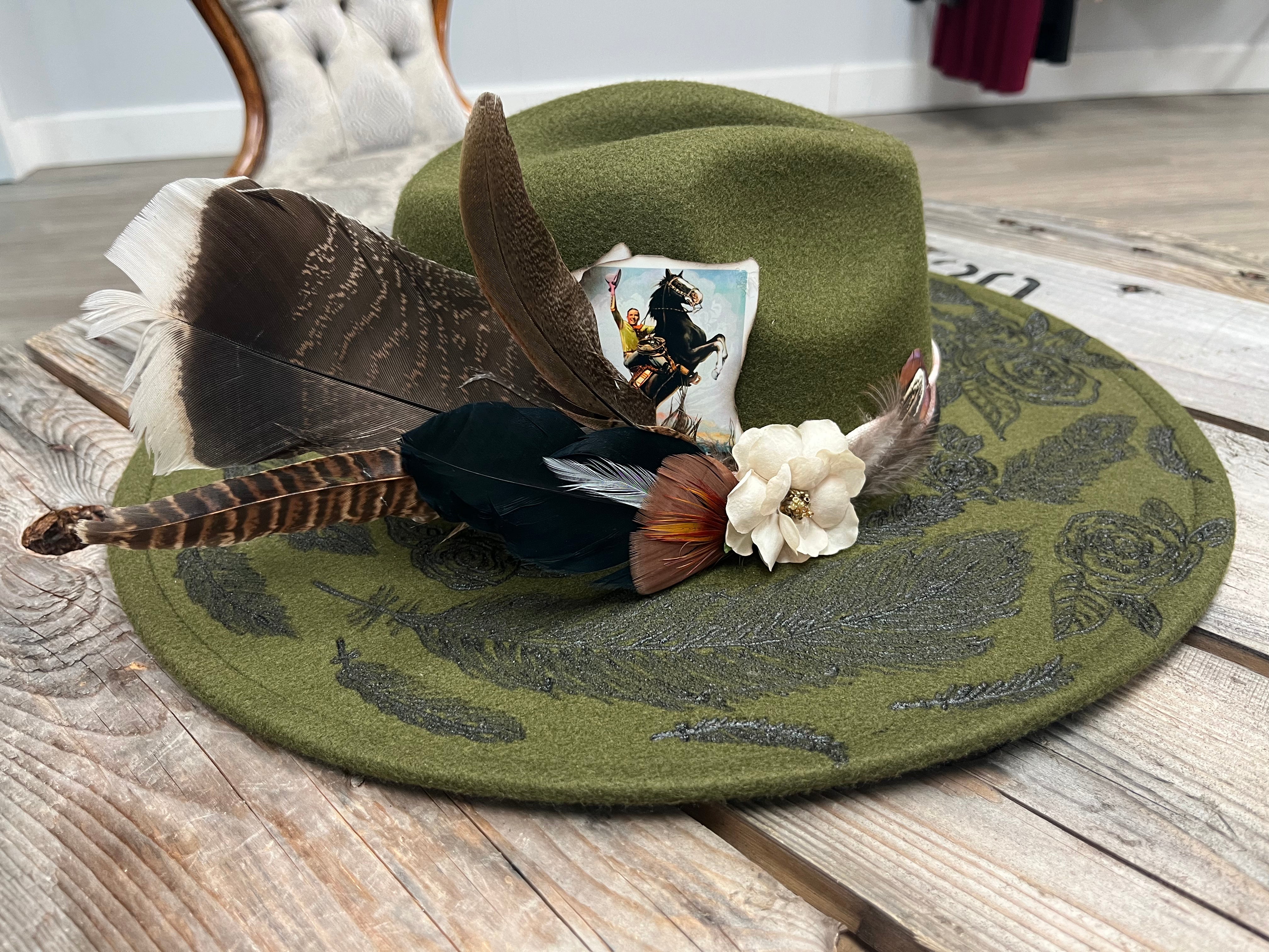 Green feather and flower hat￼￼